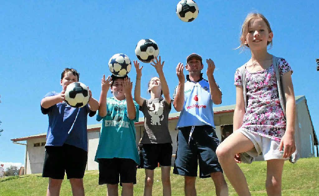 Dylan Lambert, Caine Beggs, Ashleigh and Derek Kane and (front) Madison Kane get ready for the football season. Dylan Lambert, Caine Beggs, Ashleigh and Derek Kane and (front) Madison Kane get ready for the football season.